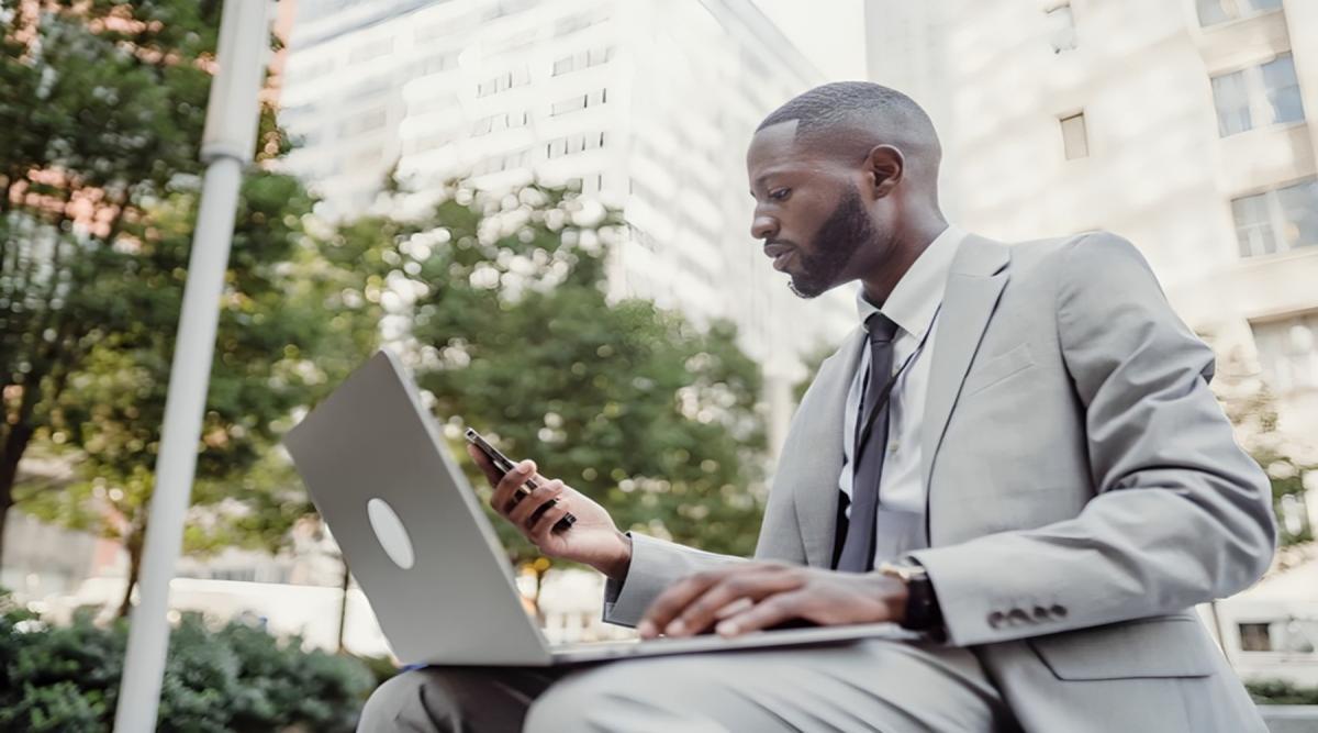 A business man using cloud unified communications solutions to work on the go.
