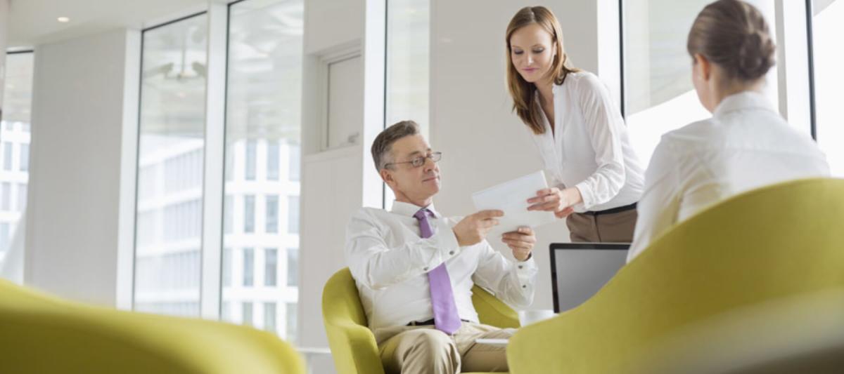 Managed Print Services, employees or partners talking in chairs