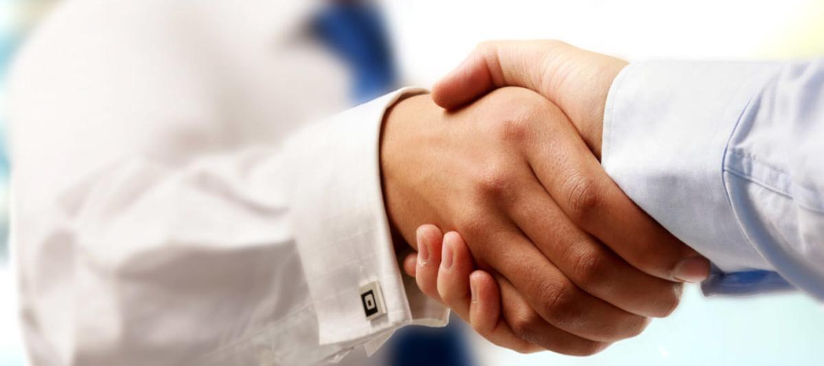 Technology Partners Page, partners concept, two businessmen shaking hands