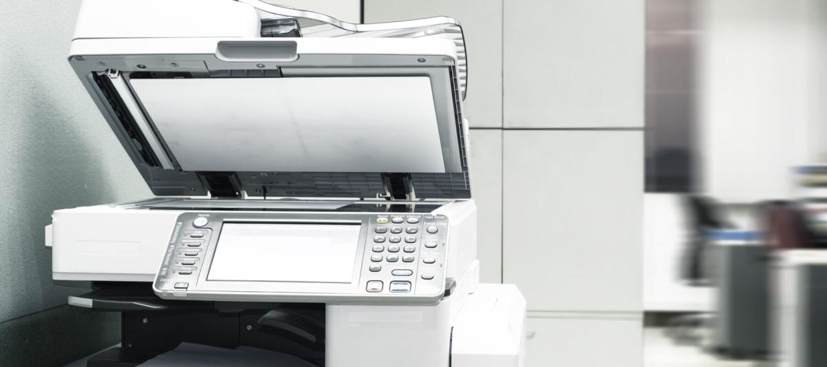 new or upgraded multifunction printer with photocopy tray open, lid open on mfp