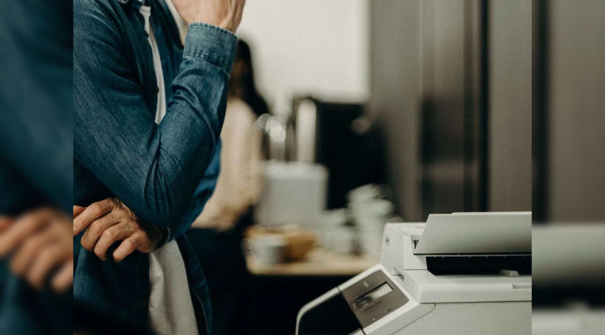 an office worker operating a copier 