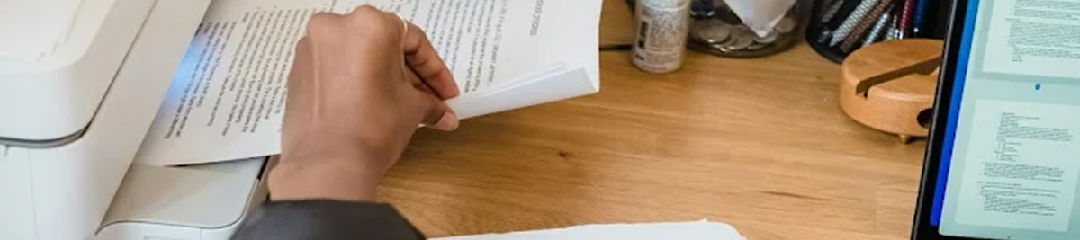 An employee in a West Chester office printing a document 